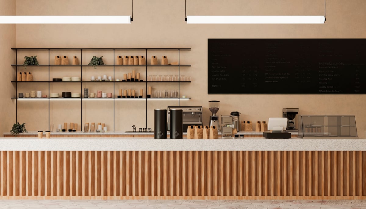 Warm interior of a cozy coffee shop with wooden counter and shelves